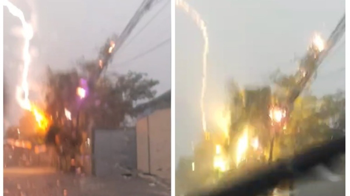 Motorista registra queda de raio perto do carro durante temporal em São Gonçalo. Chuva causou alagamentos e transtornos no trânsito