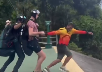 Instrutor de parapente cai em área de mata durante salto em Niterói. Equipes de resgate foram acionadas e prestaram atendimento.